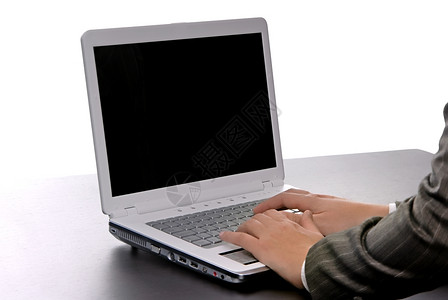 妇女用计算机工作在白色上与外界隔绝图片