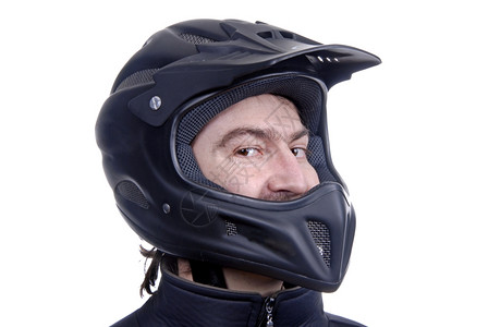 穿着黑色头盔摩托车的年轻人图片