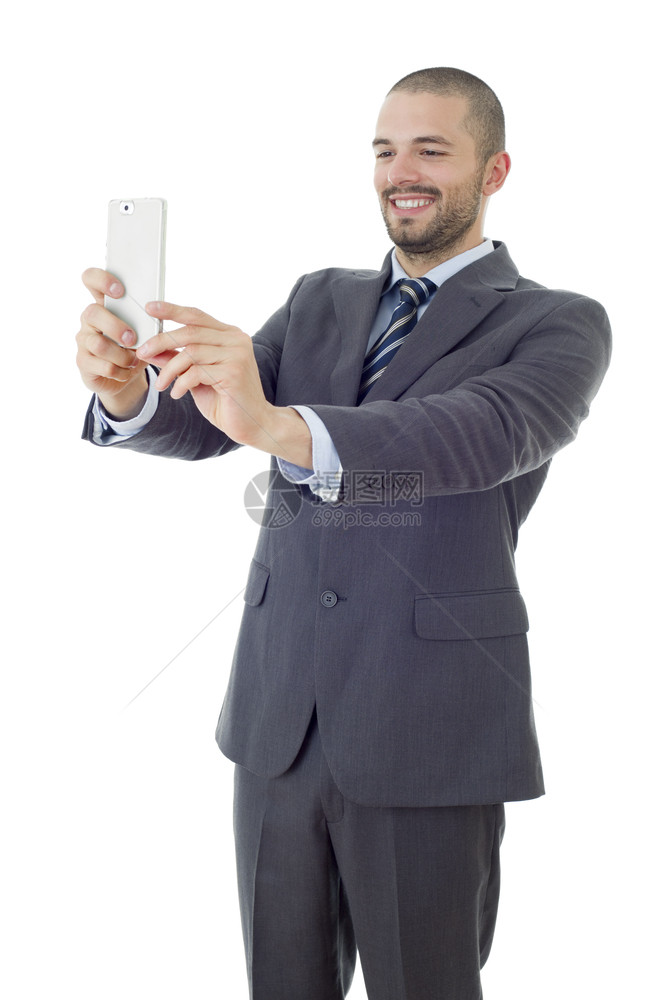 穿着西装和领带的商人用手机相拍摄自照片图片