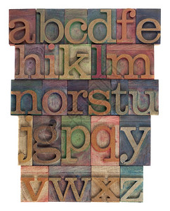 英文字母低例用旧木纸质印刷由不同颜色的墨水染平翻转白色上隔离图片