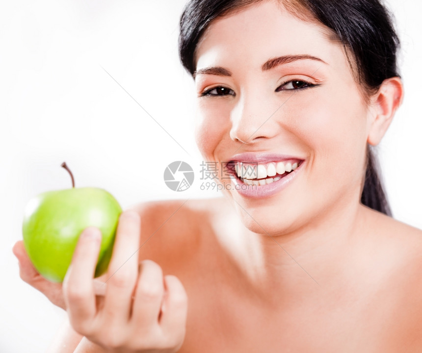 美丽的年轻女肖像带着绿苹果微笑室内工作图片