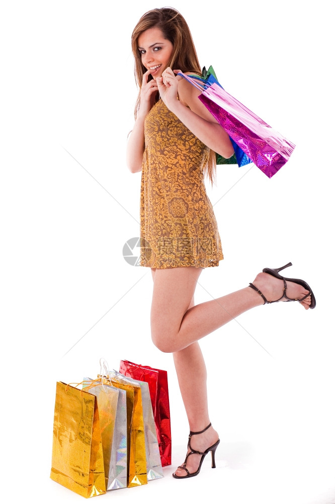 白孤立背景的年轻购物妇女图片
