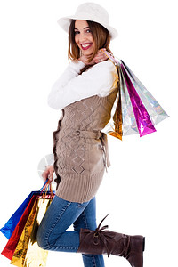 年轻妇女喜欢买东西用白色的脸背着包带行李图片