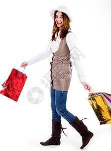 年轻女喜欢购物用白色背景着行李白衣包图片