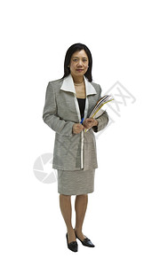 身着正式商业服装的亚洲妇女持有纸巾和白底笔图片