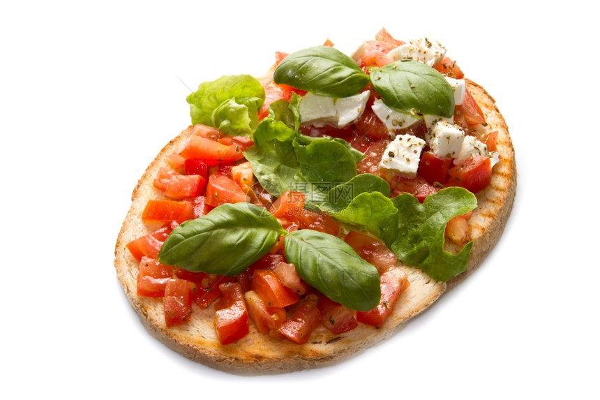意大利布鲁夏塔配有新鲜西红柿面包大蒜橄榄油和奶酪图片