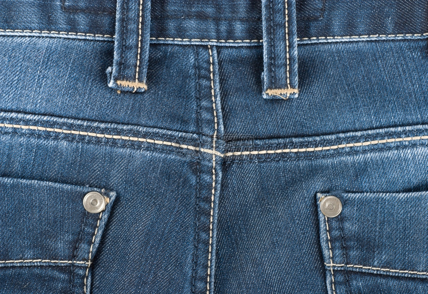 蓝牛仔裤后口袋的背景图片