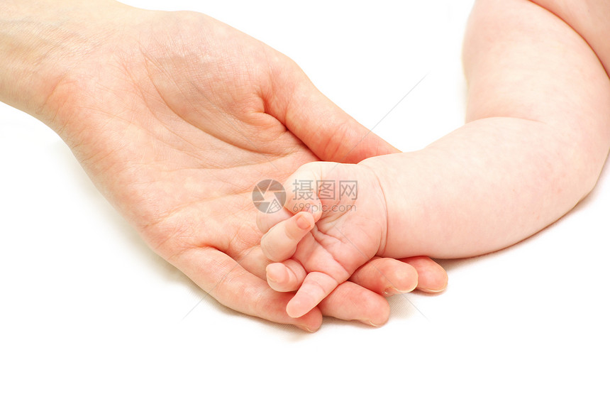 婴儿手握着母亲的指在白上被孤立图片