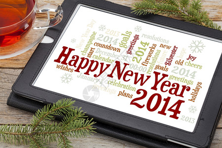 2014年新快乐数字平板上的云加一杯茶和小树枝图片