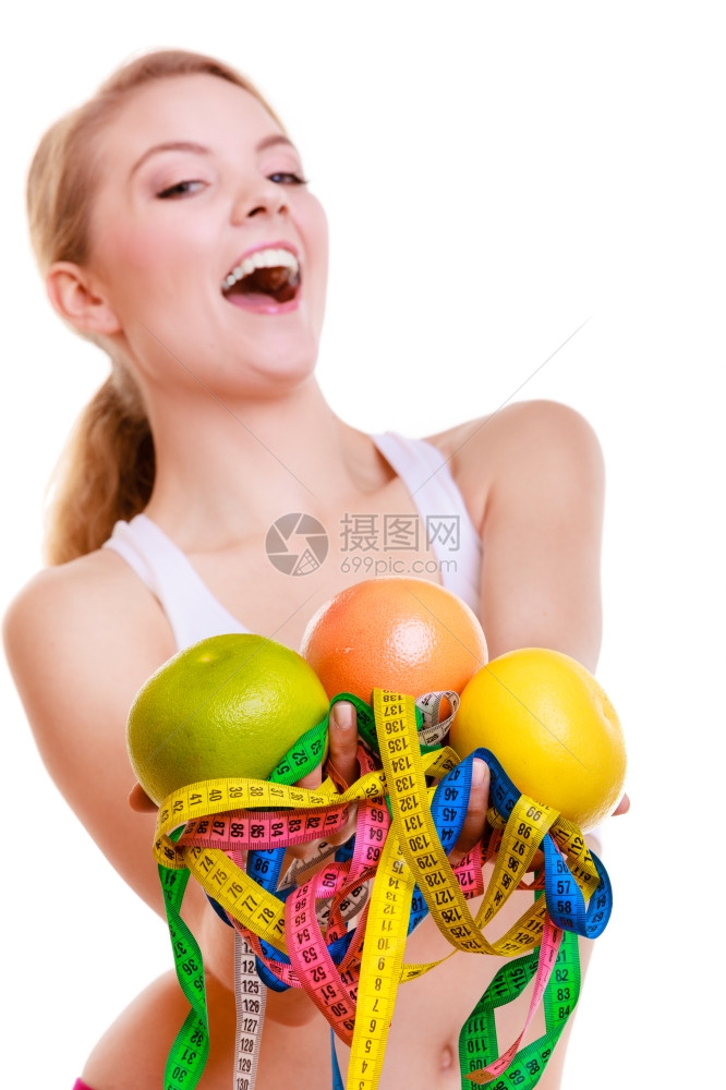 健康保生活方式运动快乐身体健康金发女郎身体健康有许多彩色测量磁带和水果白色背景的水果和图片