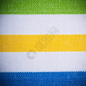 彩色绿黄蓝横向条纹织物作为背景纹理或图案宏图片