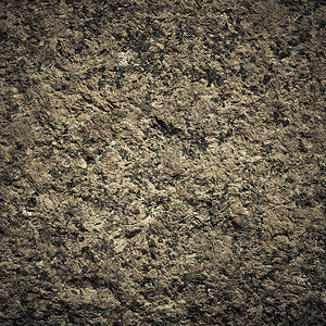 棕色灰的墙壁石头背景或质状固体自然岩石图片