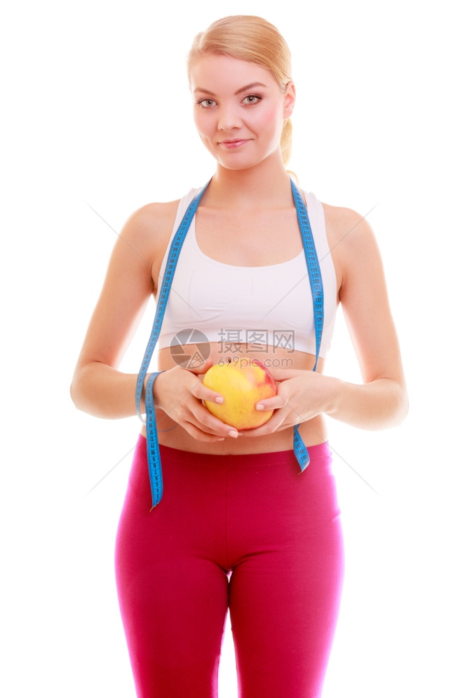 保健与康营养年轻健康女适合孩配有测量胶带和水果苹在白色上隔离图片