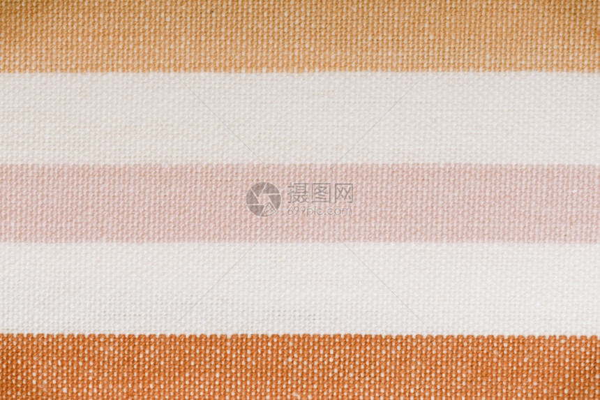 彩色粉橙横向条纹织物纺作为背景纹理或图案的关闭宏图片