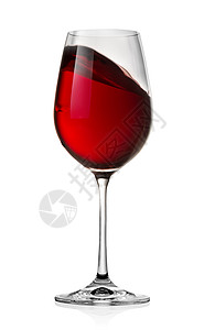 将红酒在白背景上隔绝的玻璃杯中蒸红酒图片