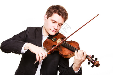 斯特拉迪瓦利乌斯年轻的优雅小提琴手玩的孤立在白色古典音乐演播室拍摄背景