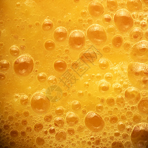 新鲜黄果汁背景质地橙色水泡宏观广场形式图片