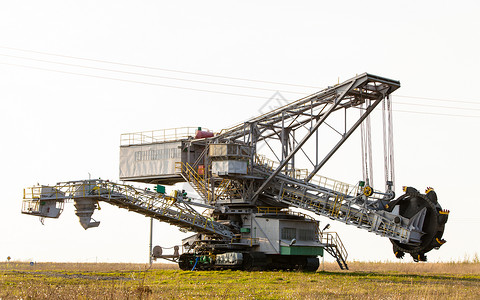 露天矿坑棕色煤矿巴克特轮式挖土机采掘业背景图片