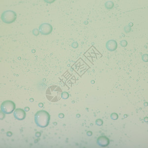 绿色灰抽象模糊液体背景带肥皂泡图片