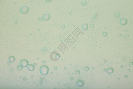 绿色灰抽象模糊液体背景带有肥皂泡沫背景图片