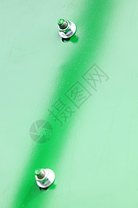 工业机械绿色金属背景细节的螺和栓图片