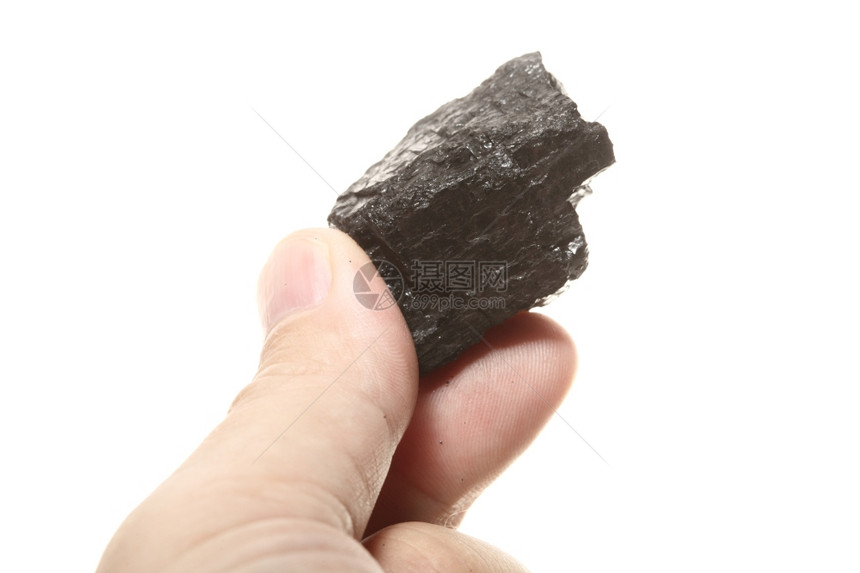 雄手中的煤块碳核糖分离在白色的电源和能量上图片