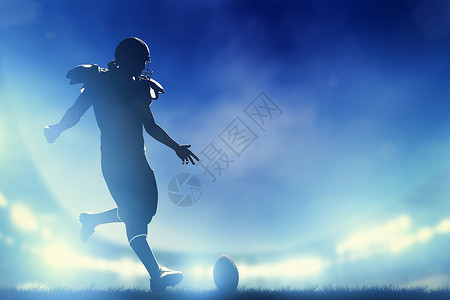美国足球运动员踢开夜场灯高清图片