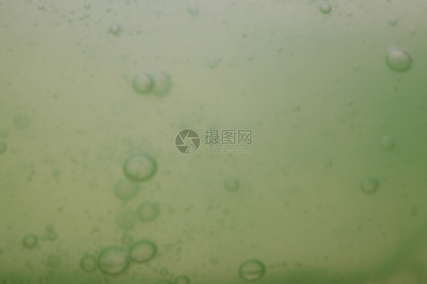 绿色灰抽象模糊液体背景带有肥皂泡沫图片
