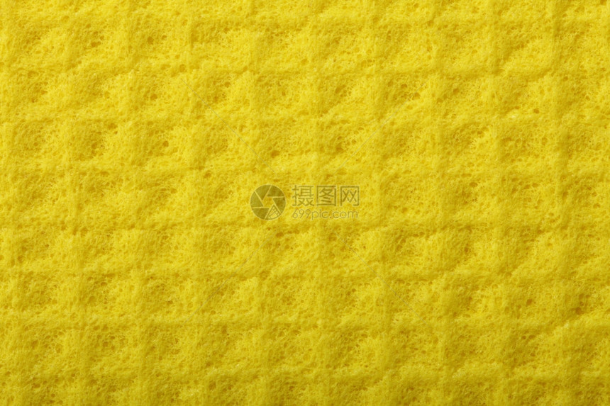 黄色厨房海绵橡胶泡沫作为背景纹理图片