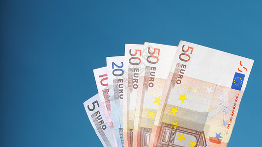 蓝背景欧元货币钞票图片