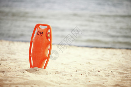 拯救海滩生命人员设备橙保护工具沙滩红塑料浮力援助高清图片
