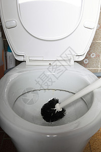 刷马桶用刷子打扫马桶清你的房子背景