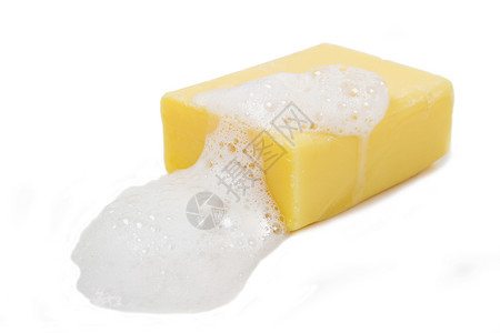 白色背景孤立的黄肥皂泡图片