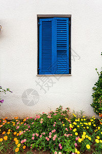古老房子的美丽蓝窗希腊风格的蓝色窗子图片