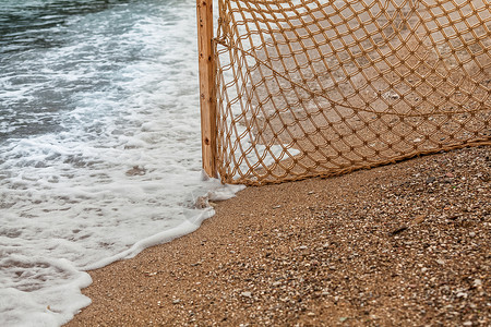 渔网线海浪沙滩渔网近距离照片背景