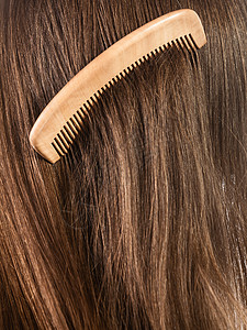 头发理概念棕直头发背景和木梳图片