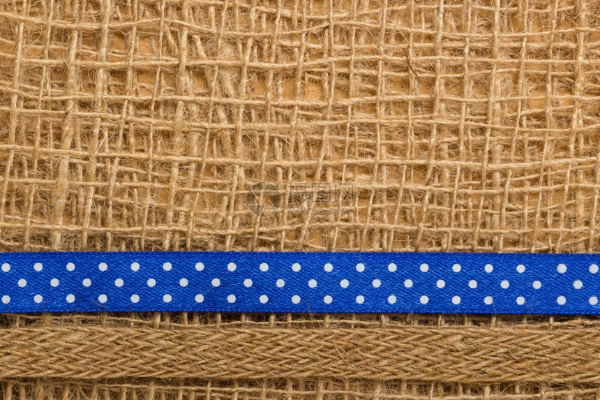 波尔卡圆点海军蓝丝带棕色网状材料天然薄膜背景图片