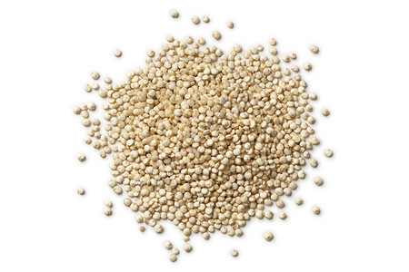 白背景的原Quinoa种子的肥料背景图片