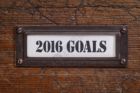 年签桃花运2016年目标一个签贴在木文件柜新年目标和决议概念上背景