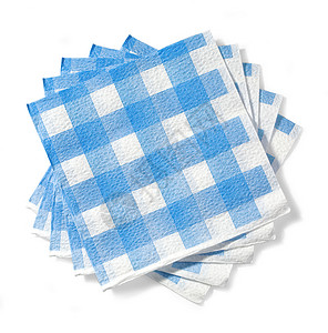 白色背景的隔离蓝笼子中白餐巾的堆叠纸带有剪切路径背景图片