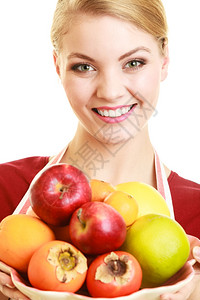 快乐的家庭主妇或提供健康水果的厨师图片