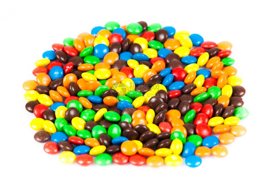 贴近一堆多彩巧克力涂着糖果彩色图片