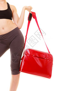 运动和积极生活方式运动服上隔离在白色运动服上的健身女郎红体操袋图片