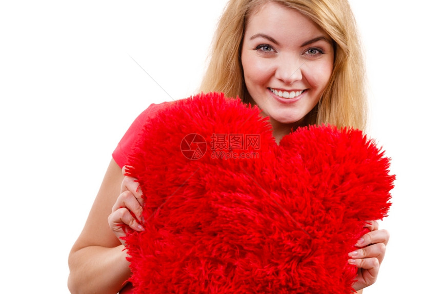 持有红色心爱符号的金发女长红大心爱金色符号演公司在白色上被孤立的片图片