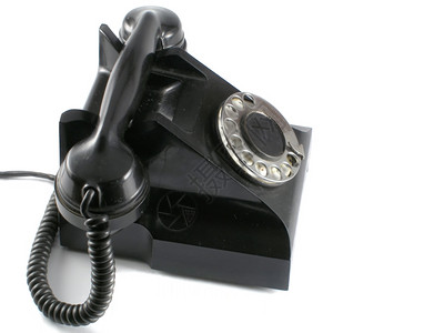 白色背景的旧黑电话图片
