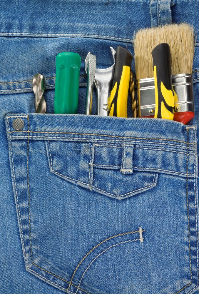 牛仔裤口袋背景的一套工具和图片