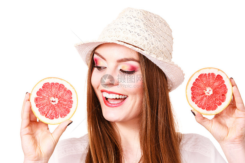 女有吸引力的长头发女多彩的双眼化妆将两半的葡萄果柑橘水握在手中健康饮食品图片