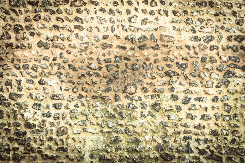 背景或纹理布模式风格的棕色设计装饰有水泥的不均匀石墙壁表面图片
