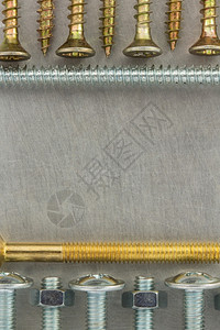 金属背景纹理的螺栓和坚果工具图片