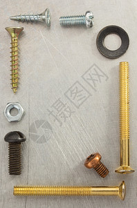 金属背景纹理的螺栓钉和坚果工具图片